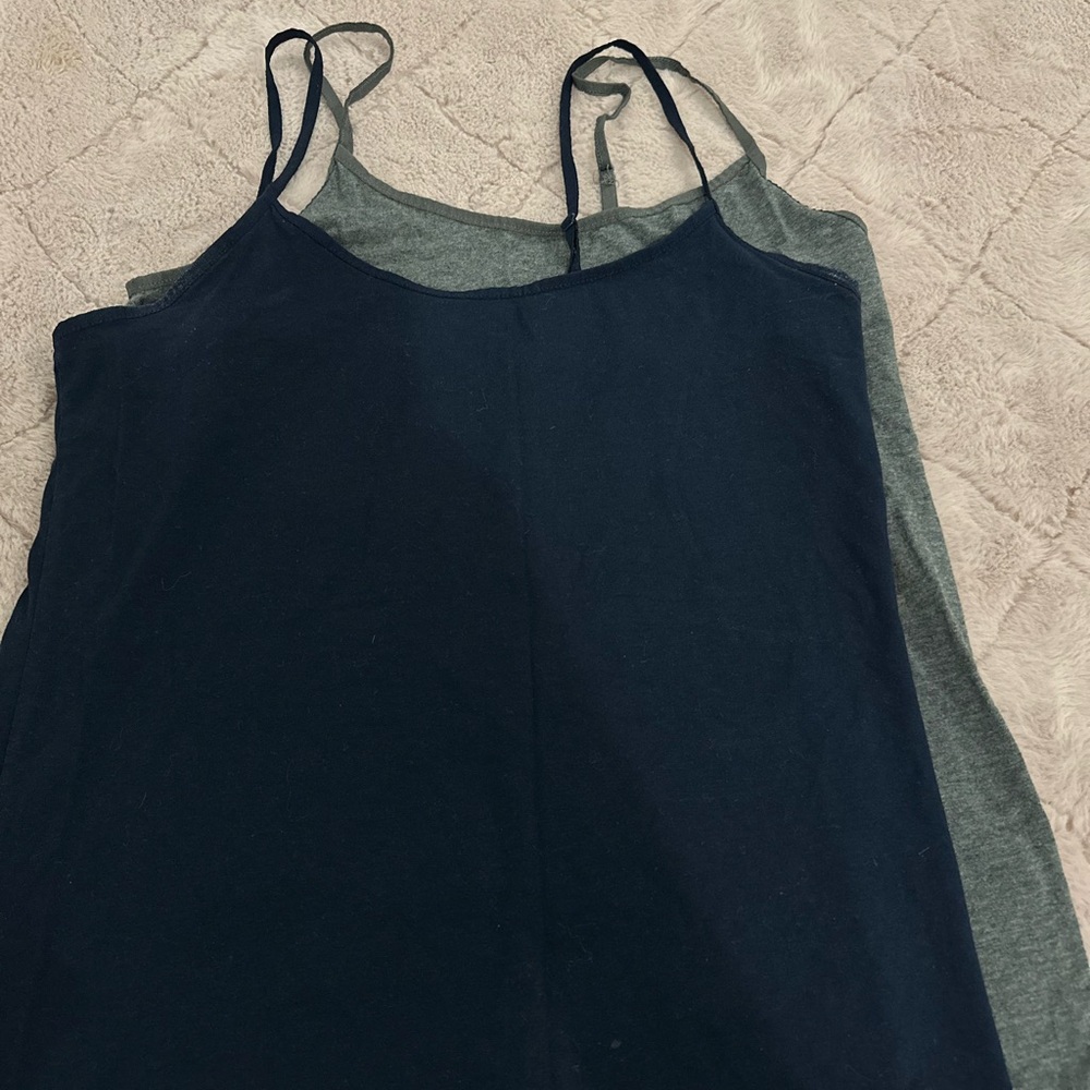 hey loves selling this pair of tank tops ! Let me know loves